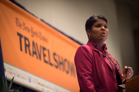 Yana Gutierrez, of AMEX, opens the mornings keynote panel, at the New York Times Travel Show at the Jacob Javits convention center in Manhattan. (Jan 23, 2015) Photo by Nancy Borowick