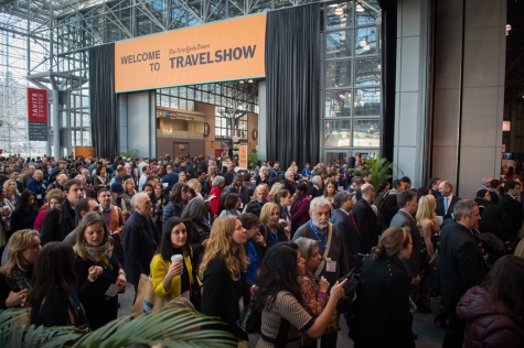 Hundreds of travel professionals flood the exhibition space at the Jacob Javits conference center as the New York Times Travel Show officially opens. (Jan 23, 2015) Photo by Nancy Borowick